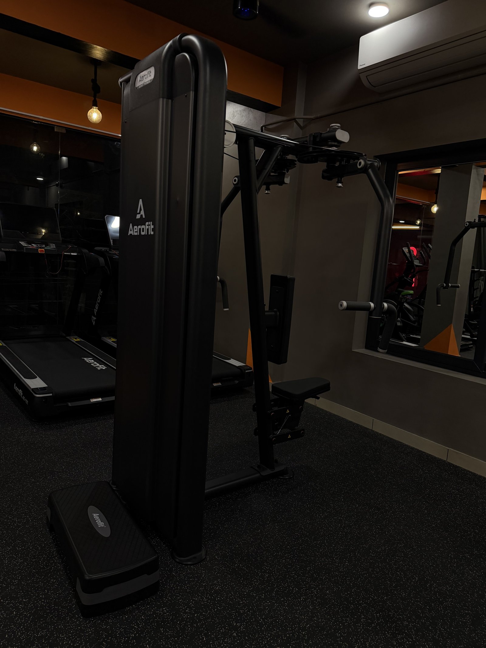 Folded treadmill in cardio area at Punch Fitness Koratty