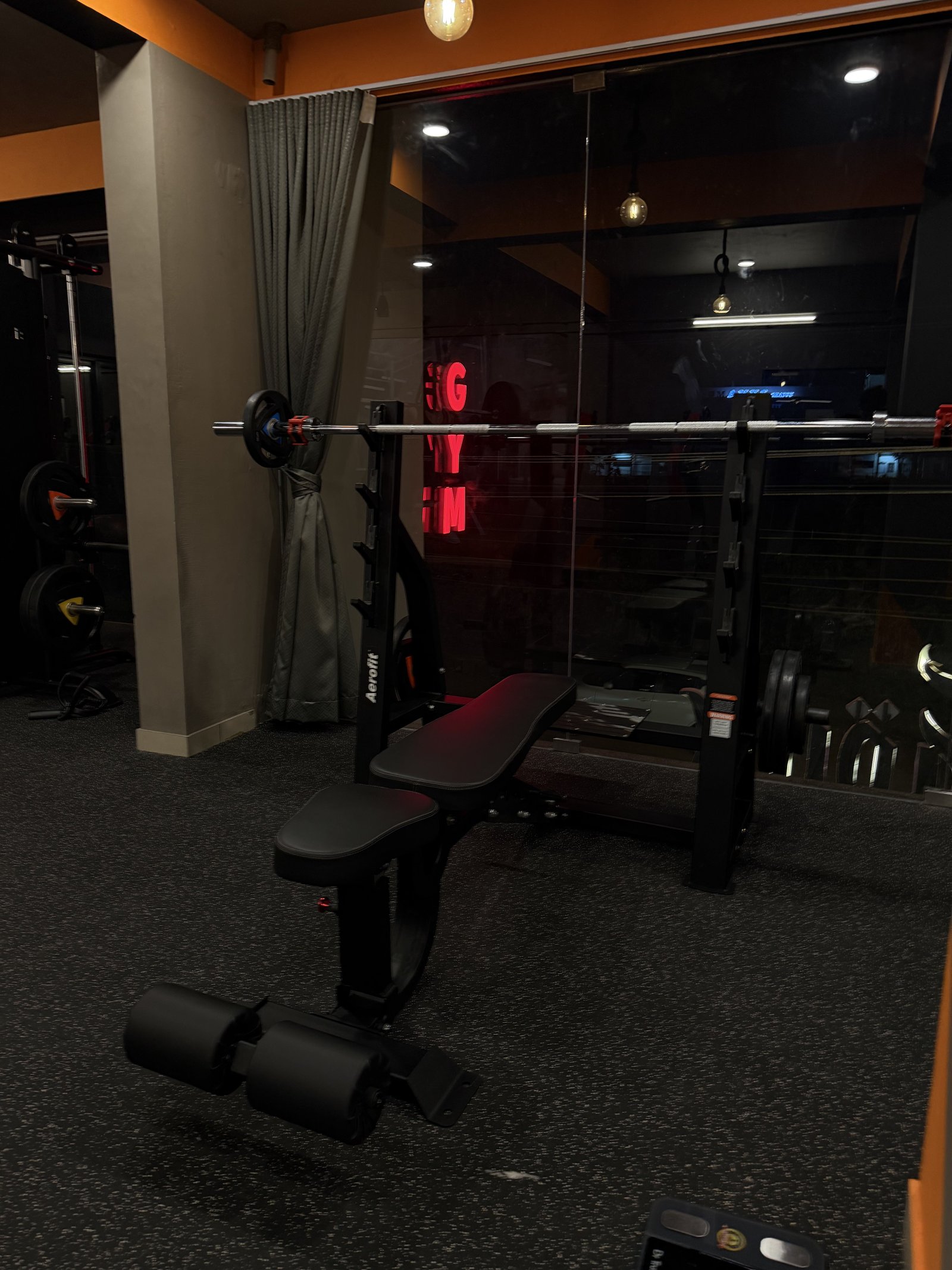 Bench and rack in free-weight area at Punch Fitness Koratty